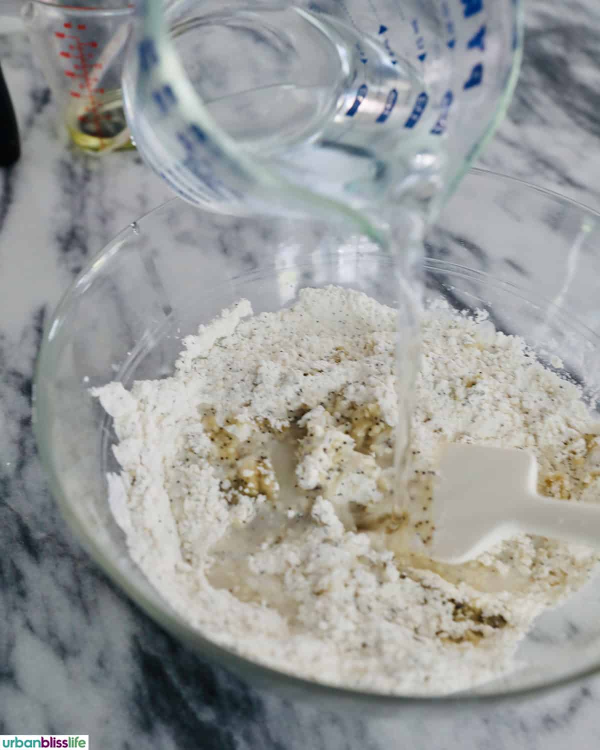 adding water to cracker dough.